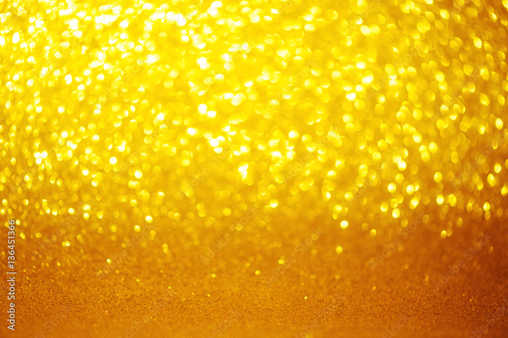 Bright shiny festive golden glitter soft golden bokeh background