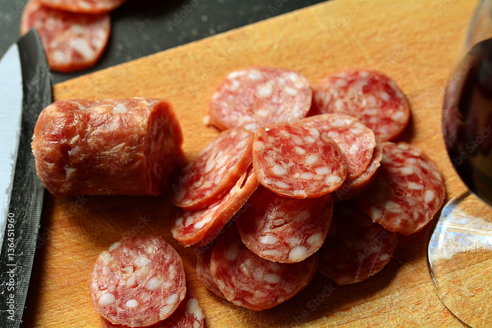Italian antipasto: homemade salami and glass of red wine. Italian antipasto: homemade salami and glass of red wine.