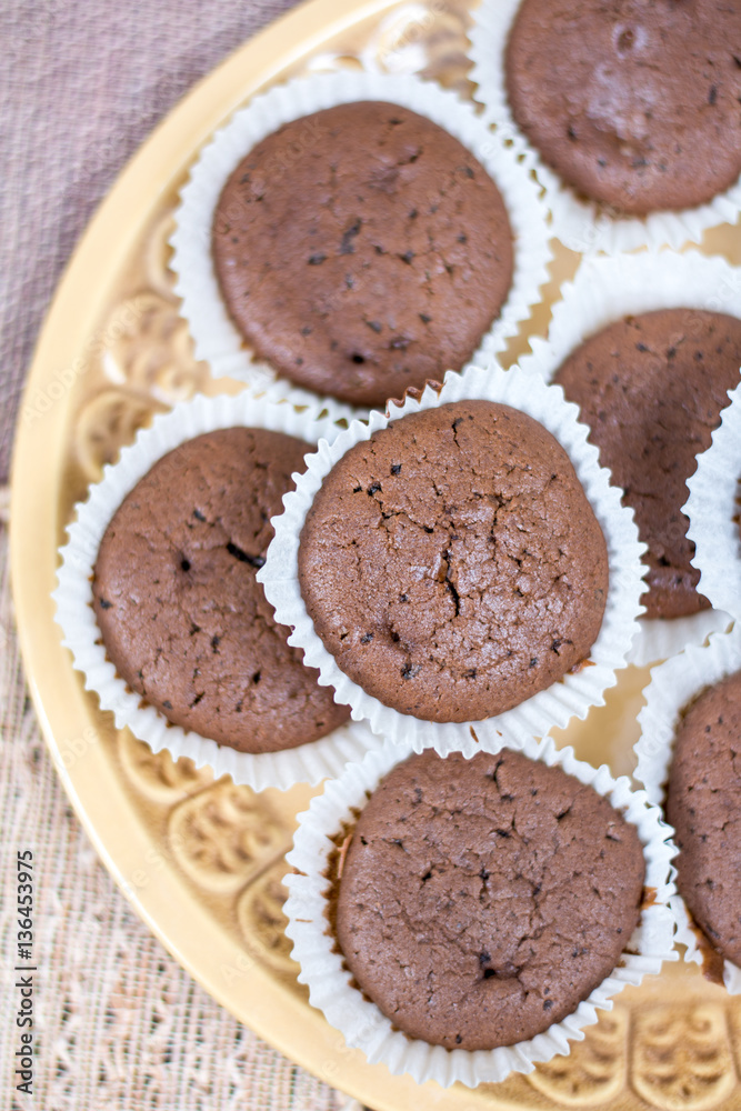 Chocolate cupcakes muffins on the plate Chocolate cupcakes muffins on the plate