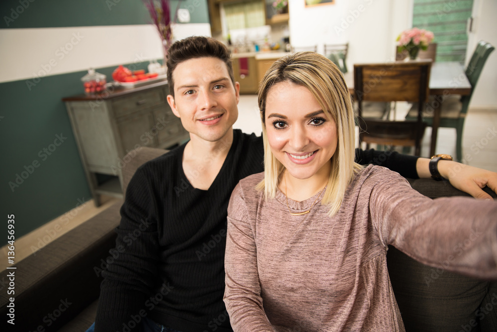 Couple taking a selfie at home Couple taking a selfie at home