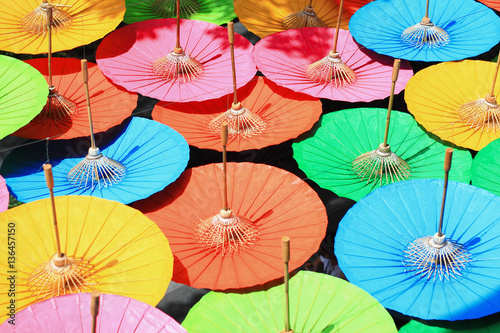 This is colorful of the Japanese umbrella. beautiful blue  yellow  orange  pink and green color as background or print card.