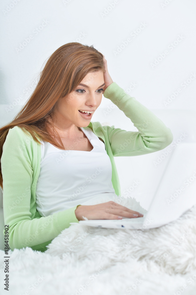 young beautiful woman relaxing in bed at home young beautiful woman relaxing in bed at home