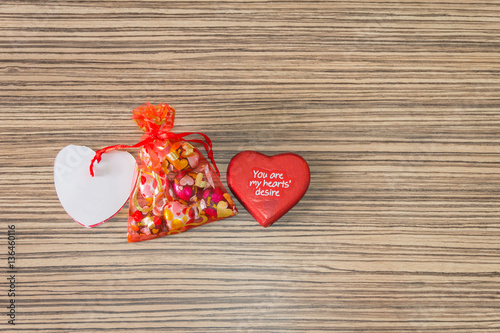 pink and red heart on a wooden background for lovers and valenti photo