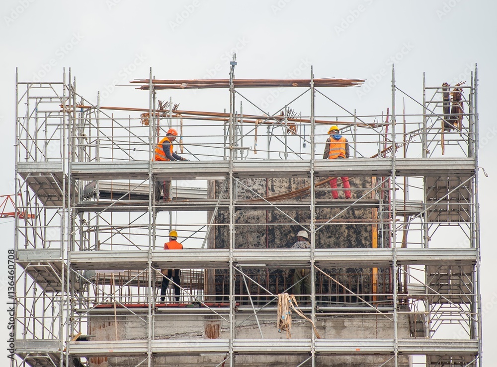 workers working on scaffolding