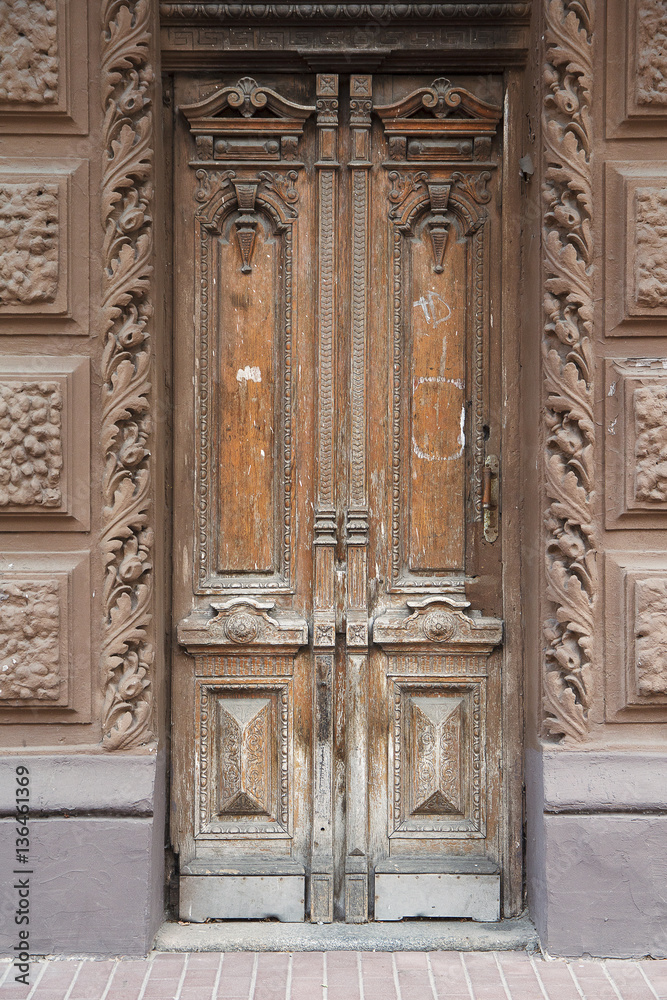 Old vintage wooden door brown. Architectural details