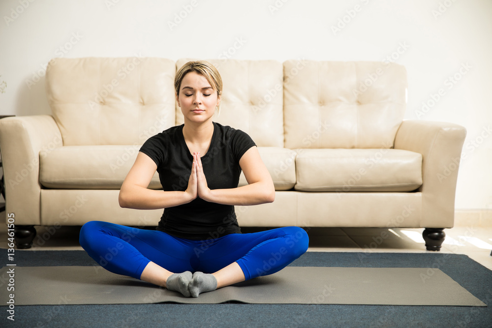 Woman meditating and doing some yoga