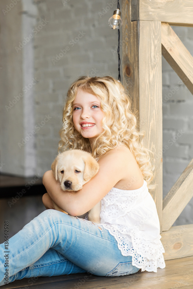 Little girl with a labrador puppy Little girl with a labrador puppy