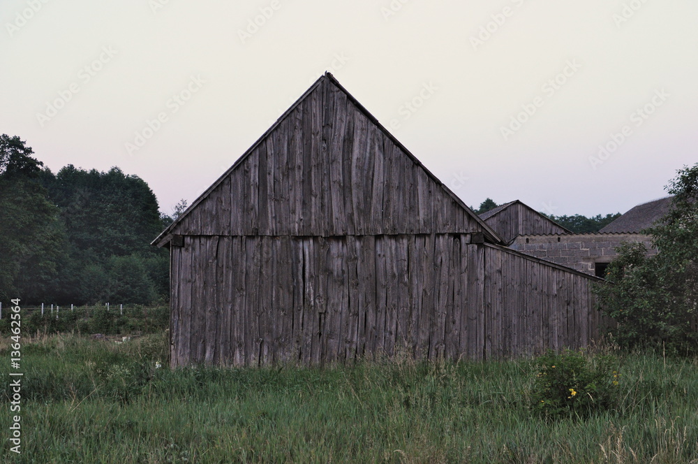 Old weathered wooden barn side view Old weathered wooden barn side view