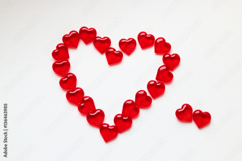 Big Heart is laid out on a white background small glass transpar Big Heart is laid out on a white background small glass transpar
