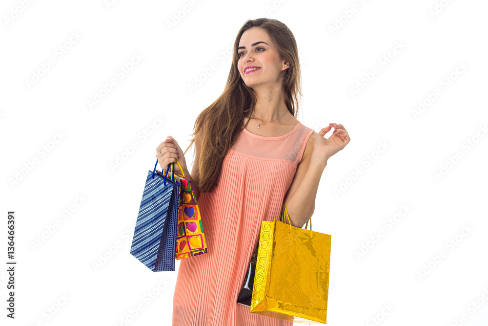 young girl stands with gifts in hands looks away and smiling isolated on white background young girl stands with gifts in hands looks away and smiling isolated on white background
