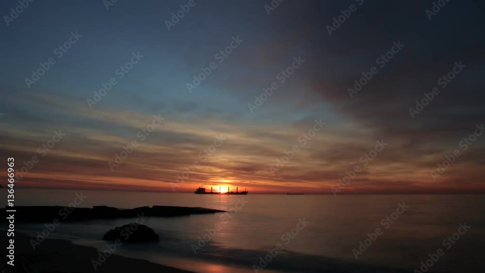 Sunrise, sun reflecting over the sea, Timelapse. Beautiful clouds over a sea at sunrise, colors of sunrise Sunrise, sun reflecting over the sea, Timelapse. Beautiful clouds over a sea at sunrise, colors of sunrise