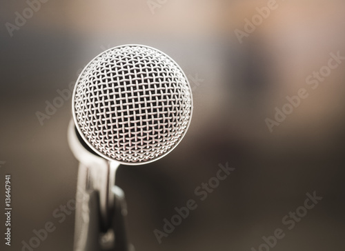 Retro color filter/ Close up of microphone in karaoke room or conference room. With place your text on background