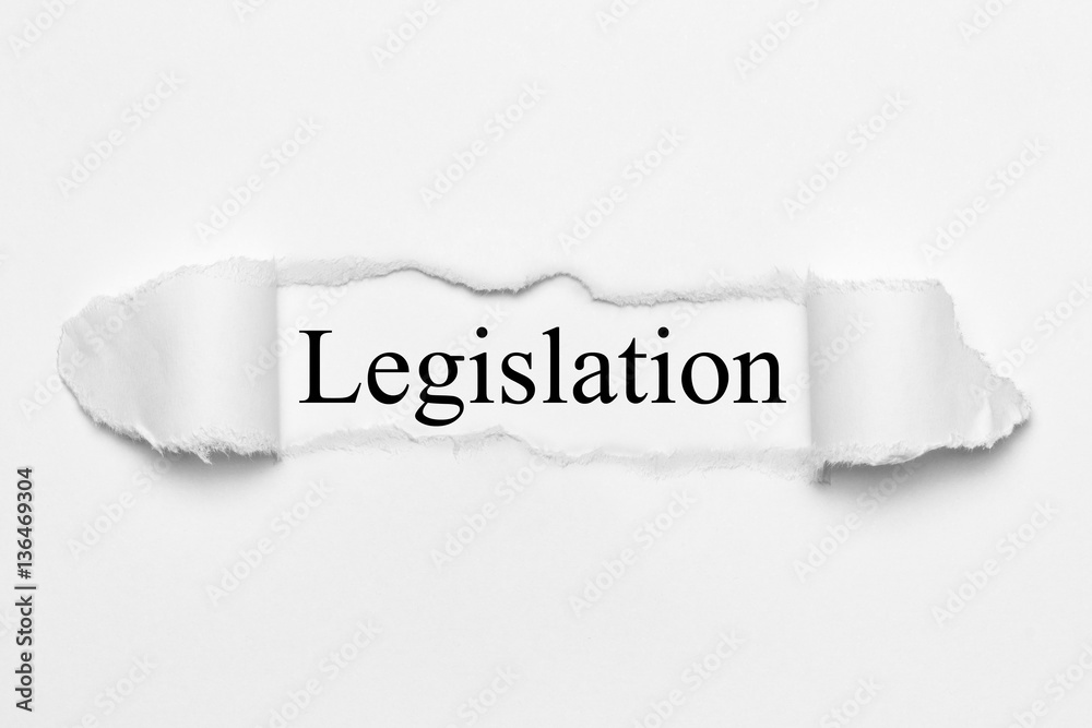 Fototapeta premium Legislation on white torn paper