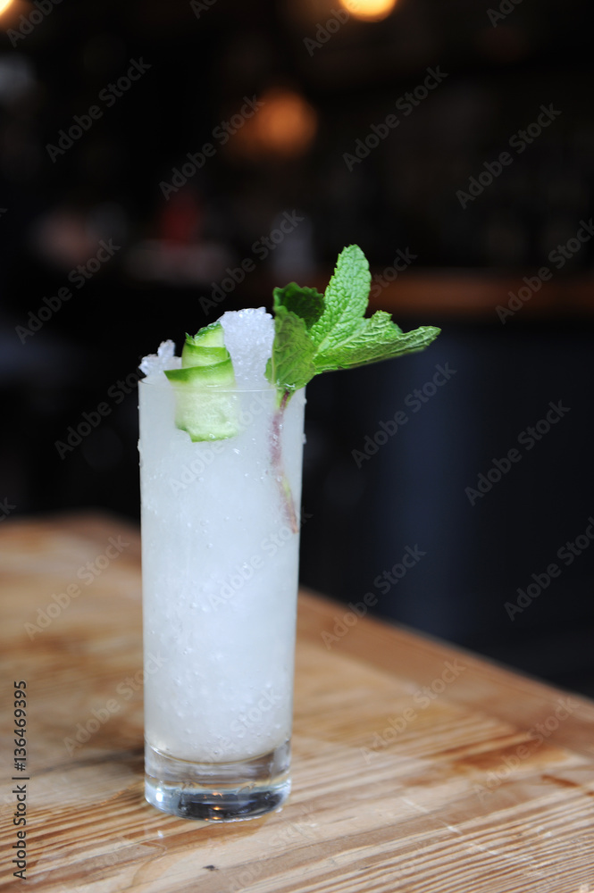 Refreshing cocktail with mint garnish at a bar Refreshing cocktail with mint garnish at a bar