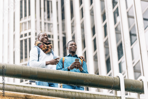 Business men using mobile in the Street.