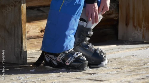 Binding ski boots on a wooden background