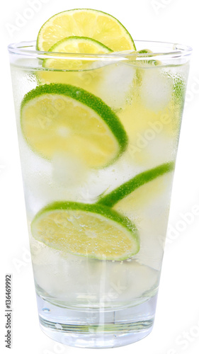 Caipirinha cocktail with ice cubes in a highball glass isolated