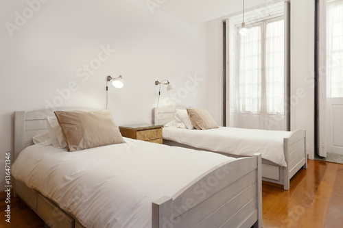 Bright and Fresh Bedroom Suite with double beds © Diana Rui
