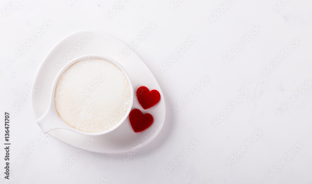 Fototapeta premium White Coffee Cup with Milk on a light Background.