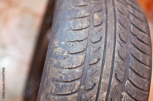 Old car tire with erased tread