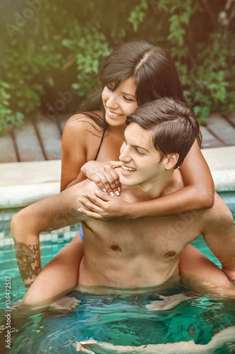 Happy couple in pool © Andriy Petrenko