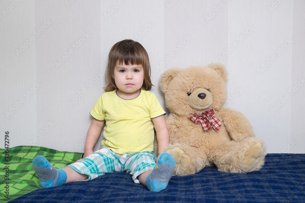 child sitting with teddy bear big toy indoor, childhood friendship concept child sitting with teddy bear big toy indoor, childhood friendship concept