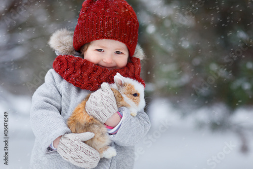 Little girl with rabbit