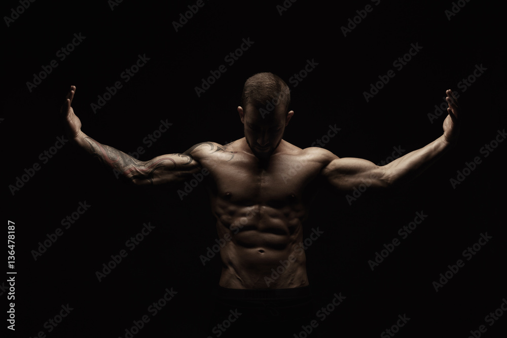 Fototapeta premium Strong athletic man showes naked muscular body