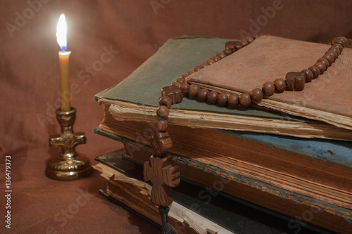 old books by candlelight