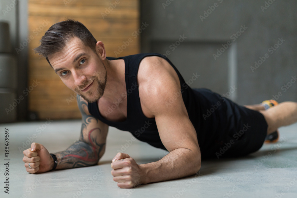 Young man fitness workout, elbow plank Young man fitness workout, elbow plank