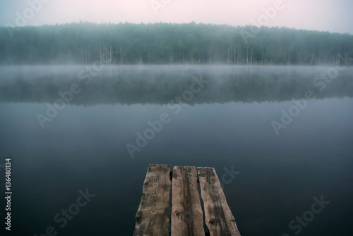 The mystical fog on the lake photo