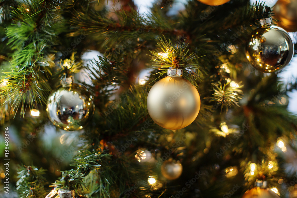 Close-up of ornaments and lights on Christmas tree Close-up of ornaments and lights on Christmas tree