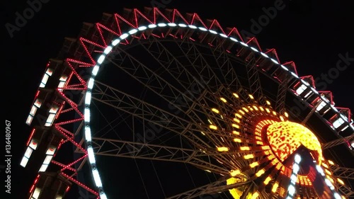 video of an illuminated ferris wheel in the evening