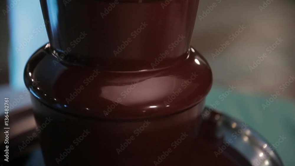 Chocolate fountain. Liquid chocolate, restaurant meals. Sweet food