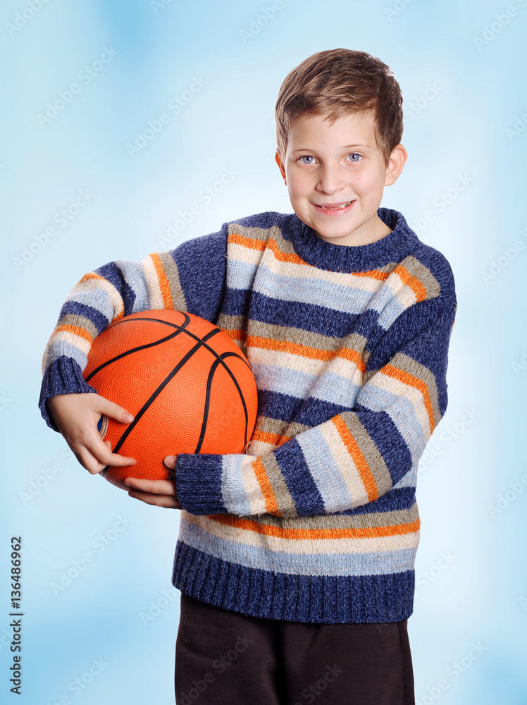 Pre-teen smiling child with basketball Pre-teen smiling child with basketball