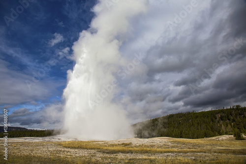 Old Faithful geyser erupting at Yellowstone National Park