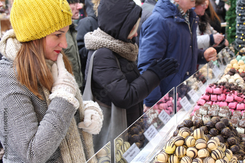 girl picking a chocolate, candy bars, jelly photo