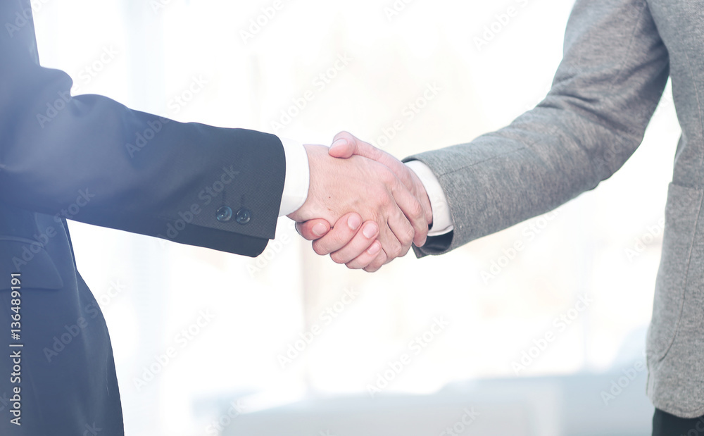 Close up of business handshake in the office Close up of business handshake in the office