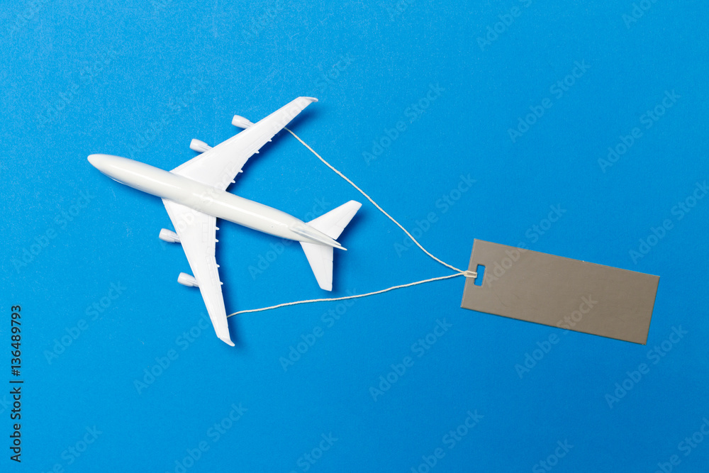 model of passenger plane on blue background