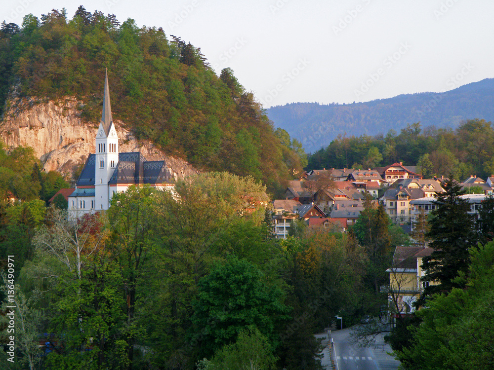 The picturesque St. Martin's Church on the hill and the townscape of Bled, Slovenia 