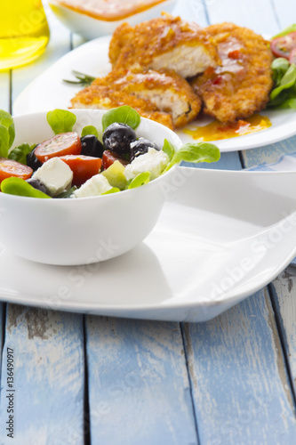 Greek salad kitchen blue wooden background 