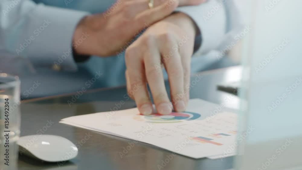 Close-Up of a businessman making notes and signs a contract Close-Up of a businessman making notes and signs a contract
