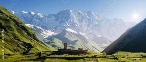Church at the foot of the Caucasus Mountains photo