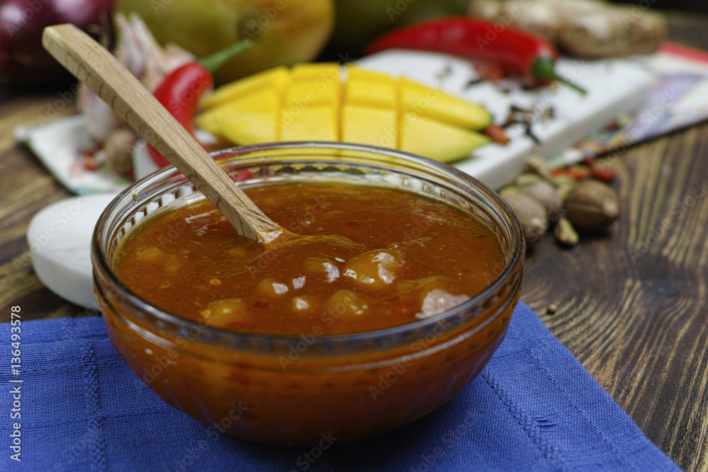 Bowl of homemade Mango Chutney on old wooden table Bowl of homemade Mango Chutney on old wooden table
