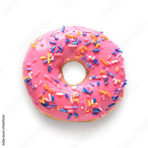Pink frosted donut with colorful sprinkles isolated on white bac