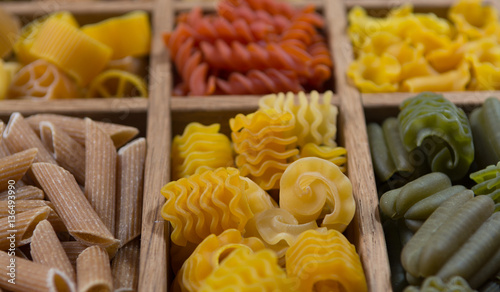 Variety of types, colors and shapes of Italian pasta. Dry pasta