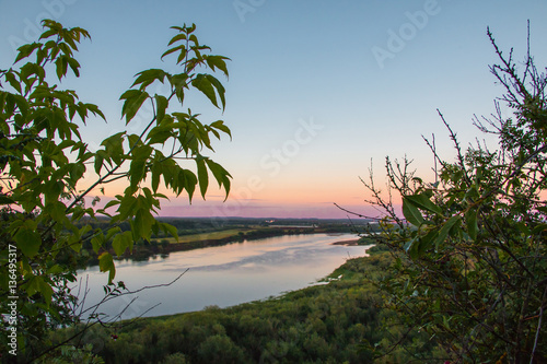 Beautiful river view through the trees from a high place © keleny