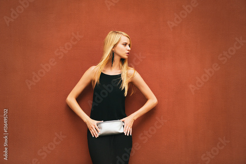 Young woman in black dress ...