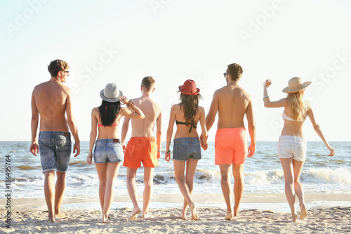 Happy friends on beach