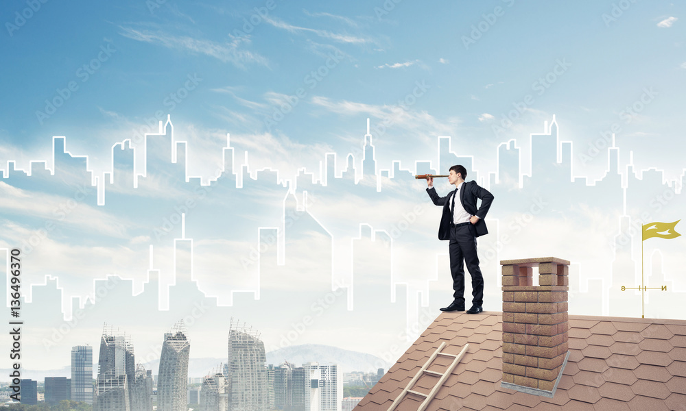 Engineer man standing on roof and looking in spyglass. Mixed med Engineer man standing on roof and looking in spyglass. Mixed med